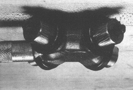 Figure 56 Cross Lube Fitting Position the cross in the yoke with its lube fitting on the inboard side (toward driveshaft), see Figure 56 Cross Lube Fitting.