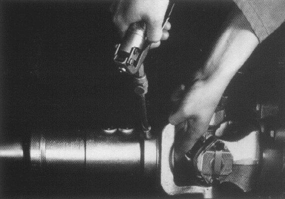 Figure 10 Pressure Relief Hole Apply grease gun pressure to the lube-fitting (See Figure 10 Pressure Relief Hole) until lubricant appears at the pressure relief hole in the plug at the slip yoke of
