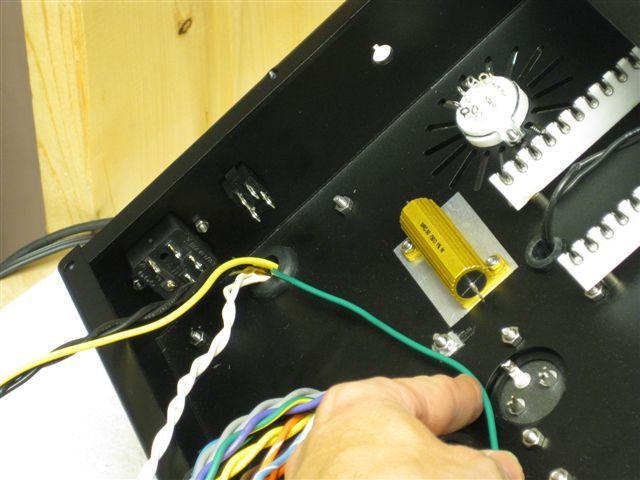 mains switch, which simply pushes through the hole. Install these as shown.