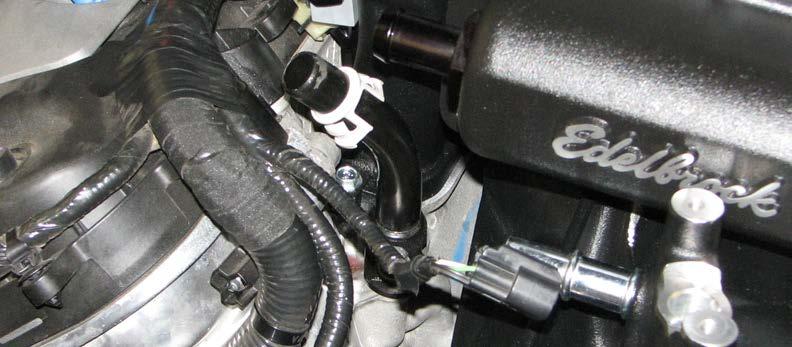 Attach the short length of 1/2 hose from the other end of the fitting, to the nipple on the driver side of the air inlet