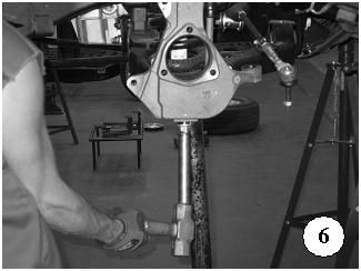 Depending on the type of ball joint removal tool you have available, it might be necessary to devise a tool to free the lower ball joint (Photo 6).