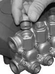 The inlet valves are located on the lower row and the discharge valves are located on the top row of the pump head.