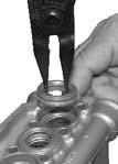 To remove the seals from the plungers simple turn the assemblies and pull off. (See Figure 18) Figure 18 4.