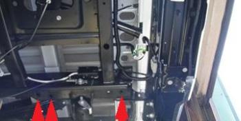 . Position the hitch against the frame, aligning the holes in the hitch with
