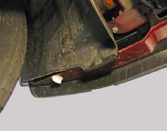 JEEP ONLY: Using a flat screwdriver in front remove two more push pins,