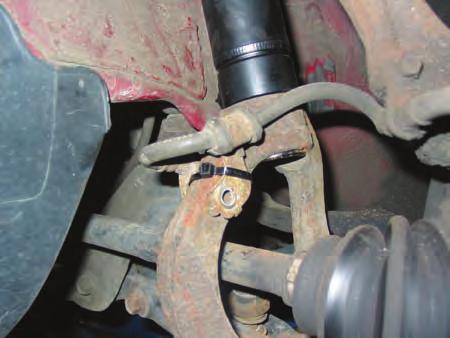 Be sure all sharp edges are removed, and paint the exposed area when complete (Figure 3). Trim Flange 3. The top bar for the upper control arm will also need to be trimmed.