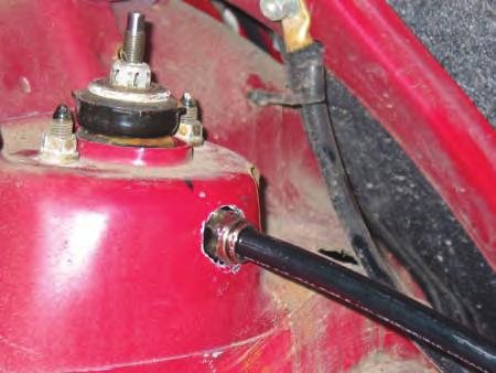 upper strut mount. Trim the rubber away with a pair of wire cutters (Figure 4). IV. Strut Assembly Installation.