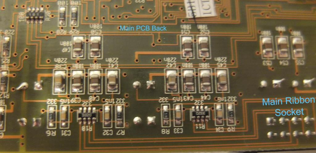 Do not leave solder bridging the capacitor connection pads. (INPUT MODS) On the older DCX version, look at the back of Main PCB.