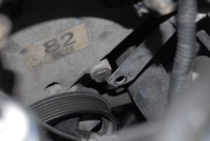 There is a studded bolt that goes into the front cover down by the power steering pump that must be modified to allow the engine accessory belt to move freely due to its new routing.