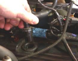 Disconnect vehicle wiring harness connectors from ignition coils, throttle