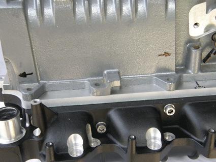 approximately.150 in the direction indicated to allow the hole to align with the tapped hole in the Tork Tech manifold.