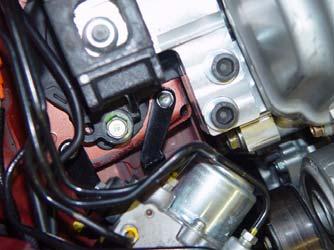Tuck the ABS unit under the frame near the headlamp to clear the engine. 5.