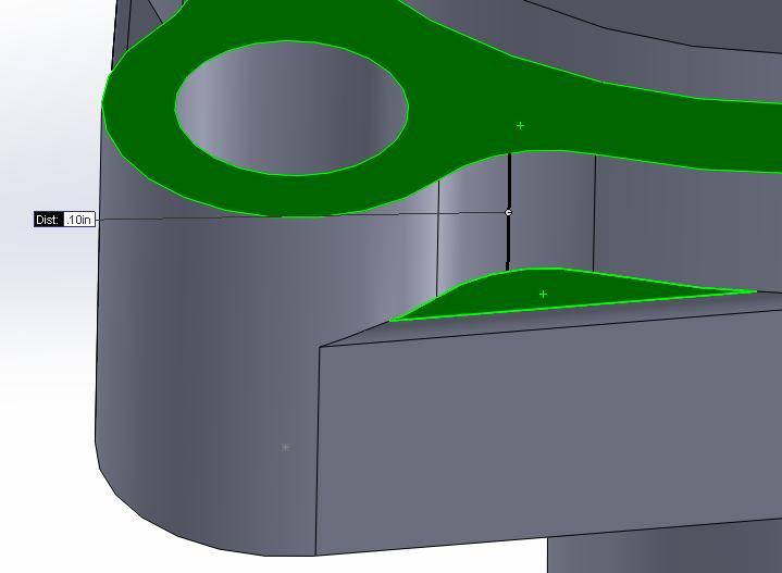 Around the outer edge on the base of the part, the draft angle