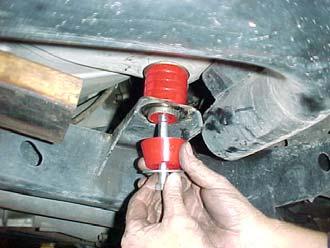 When lifting the side of the vehicle that the fuel filler is on keep a close eye not to stretch, tear or pull too far on the hose connection.) 6.