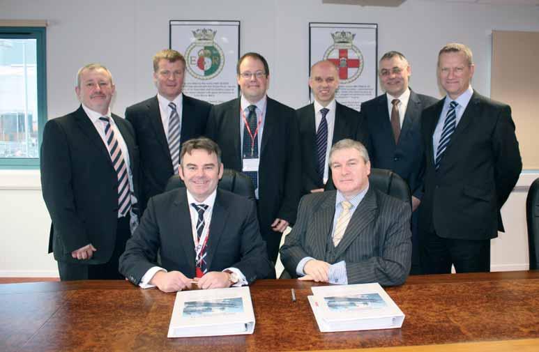 04 News from the Aircraft Carrier Alliance PROCUREMENT ABOVE: Cammell Laird contract signing, back row (l-r): Jon Pearson, Eddie Purves, Linton Roberts, Geoff Searle, Paul Bova and Cliff Crummey.