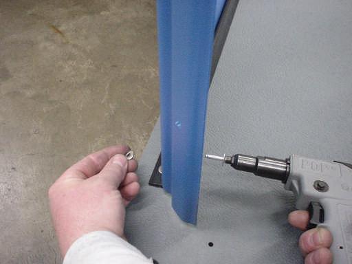 Rivet the left panel to the floor angles by installing #68 large flange aluminum rivets P/N