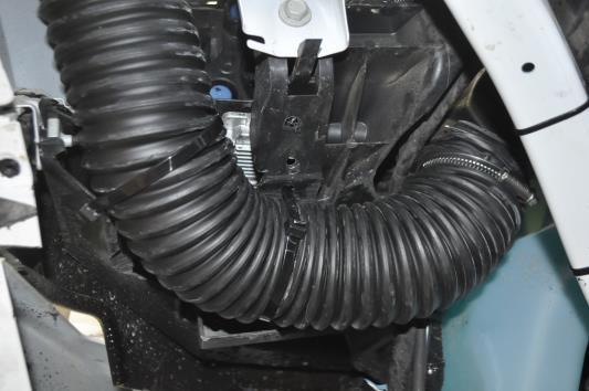 Ensure all hard plastic edges are rounded or chamfered so there will be no risk of the hose being punctured. 7. Reinstall the modified air box in the factory location. 8.
