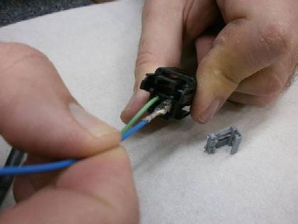 Re-insert TPA and C12 Connector into M-BEC. Figure 25. 53. Remove the C11 Connector (Gray) from the M-BEC. Figure 25. 54.