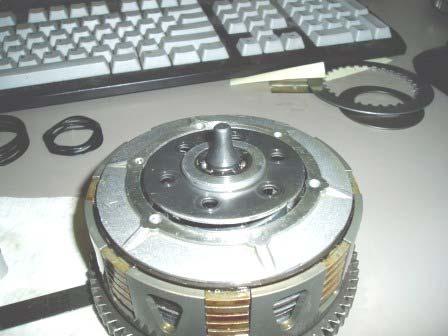 Install the clutch cover making sure the push rod and throw-out bearing stay located. n.