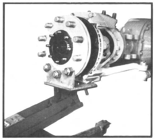 Install transmission jack adapter on a suitable transmission jack (See fig. 11 and Tool Reference, Section XII).