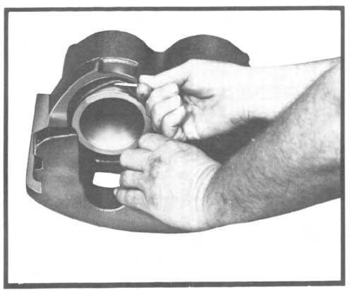Gently work the seal around cylinder bore with a finger until it is properly seated into the seal groove. Be sure the seal is not twisted or rolled in the groove. (Fig. 31) Fig.