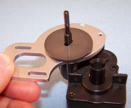 Place a slipper plate (5530) over the top shaft with the hub down, flat