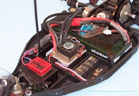 I12) If you are using Lipo, install the ESC (not included) using double-sided tape in the center of the chassis just ahead of the battery, and the receiver in one of the side bays.