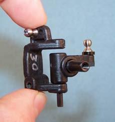 Install a 3/16 ball stud from the front in each caster block.