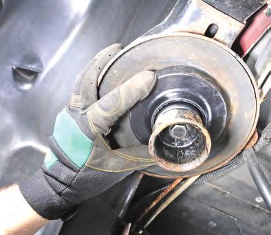Remove bump stop cup using a 15mm socket (see FIG 19) INSTALL COIL SPRING AND