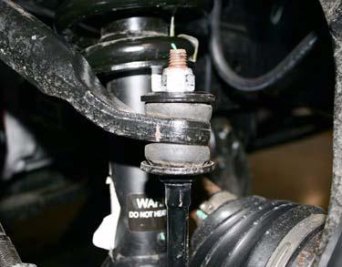 Install upper A-arm onto steering knuckle with nut. TORQUE to O.E. specification. Tie Rod f. Repeat above substeps for passenger coil-over assembly.