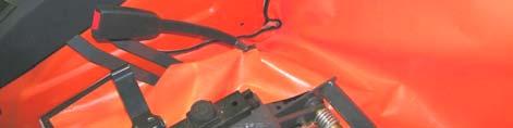 The top middle section of the under seat filler attaches to the bottom of the soft rear curtain or to the