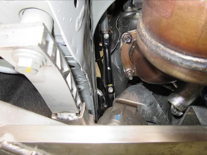 Remove the wire loom bracket on the right side of the engine by loosening the 13mm bolt securing it to the engine, pull the bracket and