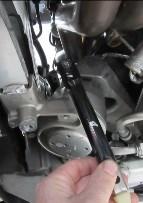 Loosen and remove the single T30 Torx bolt that secures the dipstick assembly to the engine.
