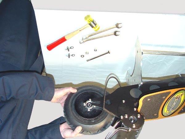 Wheel Removal Rear Wheel NOTE: Extreme caution should be used when servicing the drive chain or rear wheel.