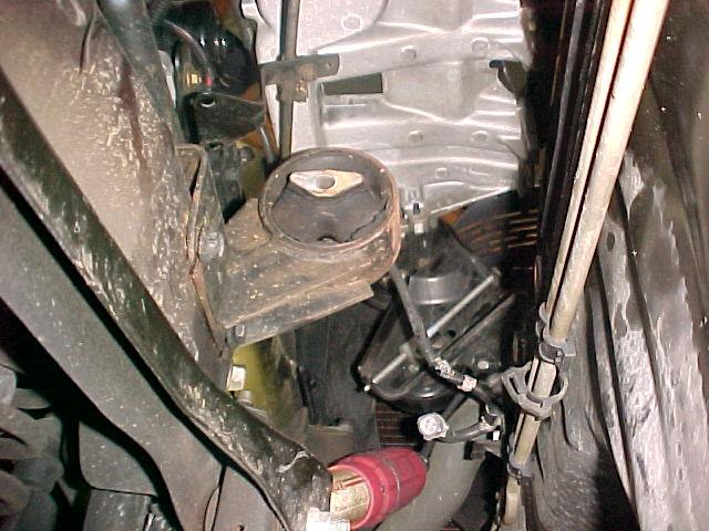 NOTE: USE FLOOR JACK TO SUPPORT THE WEIGHT OF THE ENGINE ON CHEROKEE MODELS ONLY! 5. THEN FINISH REMOVING ALL INTAKE MANIFOLD BOLTS AND NUTS.