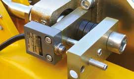 Sprung roller acting on the underside of the beam eliminates the need for a counterweight. Increases life of the wheel rolling surface as a result of lighter hoist weight.