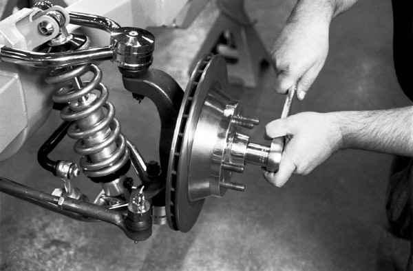 To fully seat the bearings, tighten the castle nut to 12 lb-ft while turning the rotor
