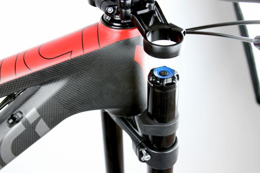 Use a 4 mm hex wrench to tighten one of the lower crown bolts to temporarily hold the tubes in place while