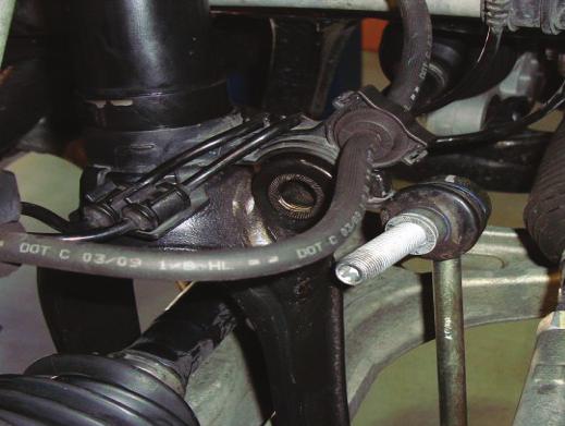 5. REMOVE THE NUT FROM THE BALL JOINT AND SEPARATE FROM