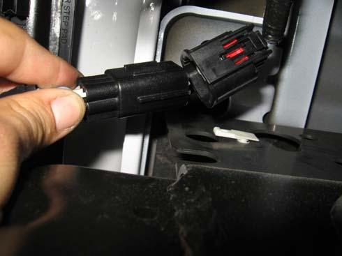 Step 2: Unplug and remove the OE trailer harness receptacle wiring plug, if so equipped.
