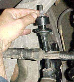 8) Re-install the front sway bar and use a 15mm wrench or socket to tighten the bolts holding