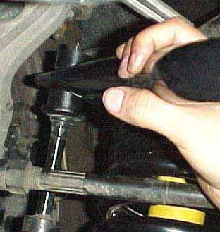 10) Rotate the ends of the sway bar over the end links.