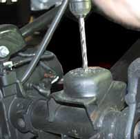 If installing a Skyjacker Steering Stabilizer (Part# 7003), Remove the OEM steering stabilizer using a 18mm socket. (See Photo # 2) 7.