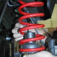 11. Install the bump stop spacer & coil spring.