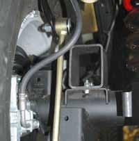 35. Attach the brace to the front side of the Skyjacker track bar bracket between the bracket & the coil spring. Do not tighten at this time.