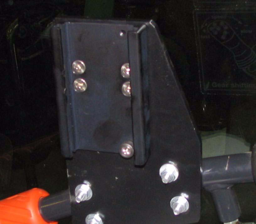 using the four small screws provided. See Figure 4-4.
