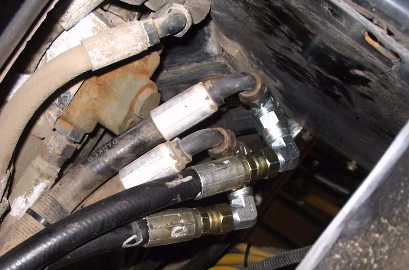 Connect AutoFarm Steer-Out Hoses Figure 7-9 Connecting the AutoFarm Pressure Hose vehicle pressure hose AutoFarm pressure hose CAUTION Confirm the ports on the orbitrol by looking at the