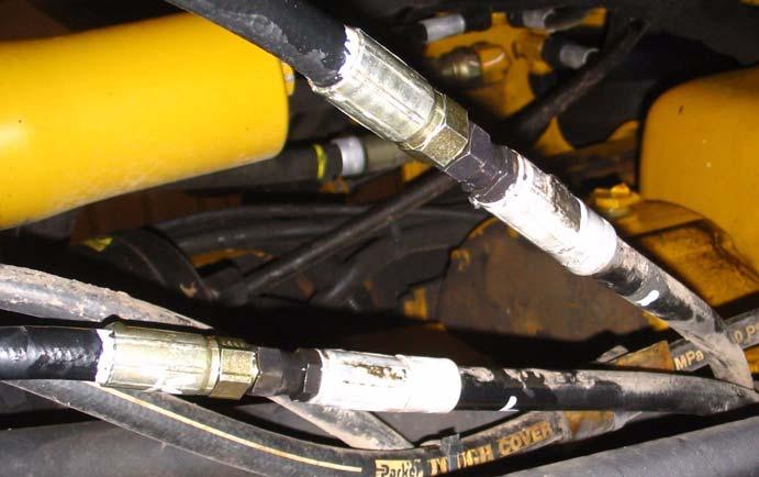 Connect AutoFarm Steer-Out Hoses Figure 7-10 Identifying the Vehicle Right and Left Steering Hoses vehicle left steering hose vehicle right steering hose 2.