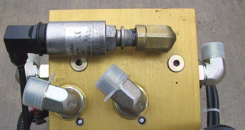 Attach the Pressure Transducer 2. Attach the pressure transducer to the 90 degree fitting. See Figure 7-19.