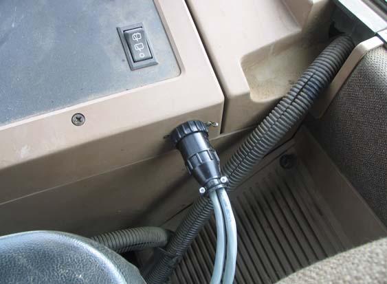 Figure 9-3 and Figure 9-4 show the power outlet you may encounter in a Crenlo cab and in a John Deere cab.